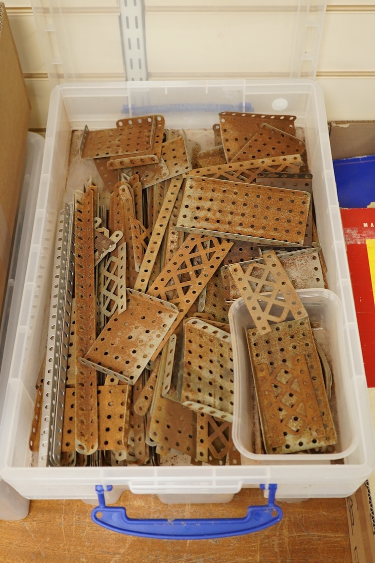 A large quantity of early Meccano construction parts, including a variety of specialist parts from the earliest sets produced and the original box for set No.3